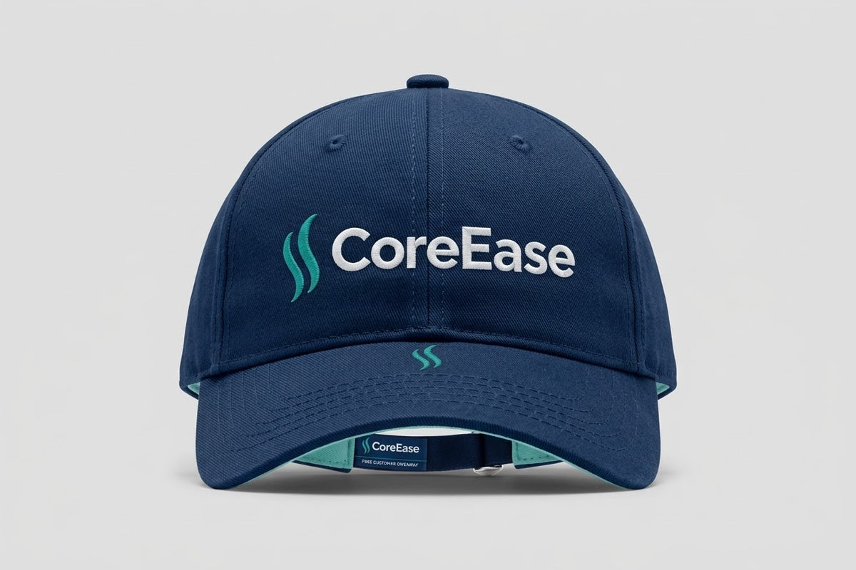 Navy COREEASE baseball cap with white lettering, teal front emblem and curved brim
