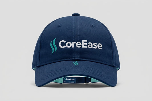 Navy COREEASE baseball cap with white lettering, teal front emblem and curved brim